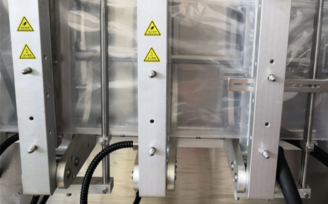 Dispositif de scellage vertical pour machine de formage de sacs